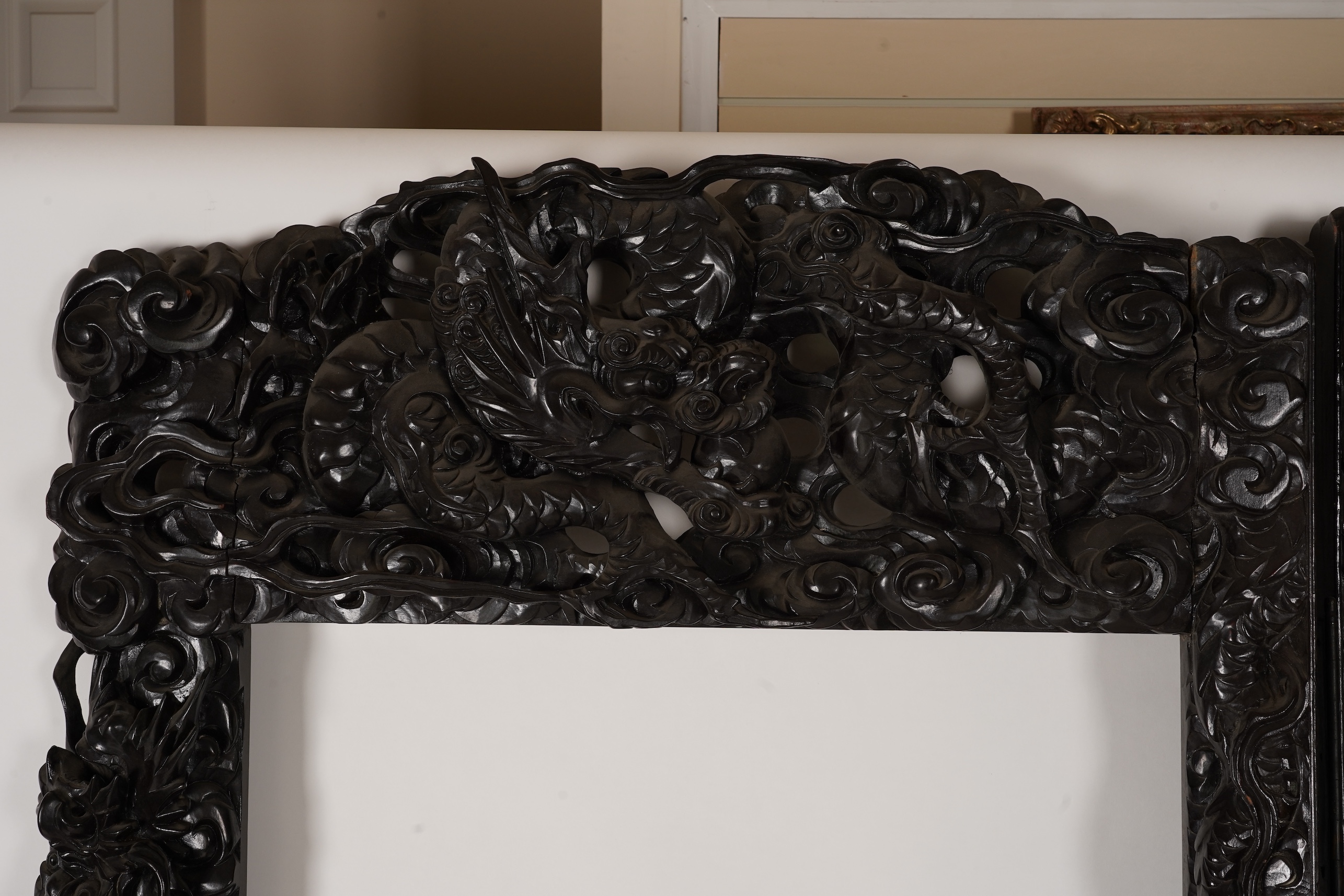 A pair of large Japanese carved hardwood ’dragon’ screen frames, Meiji period